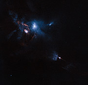 Hubbleteleskopets bild av omgivningen kring den unga stjärnan HL Tauri