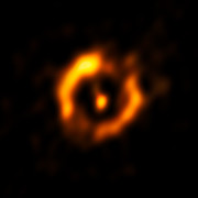 Den dammiga skivan runt den åldrande dubbelstjärnan IRAS 08544-4431