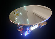 A 3D rendering of an oval mirror standing on top of a mechanical structure, in front of a black background and illuminated by a blue light from below. The mirror reflects the ceiling of a white room with construction equipment and bright blue lights.