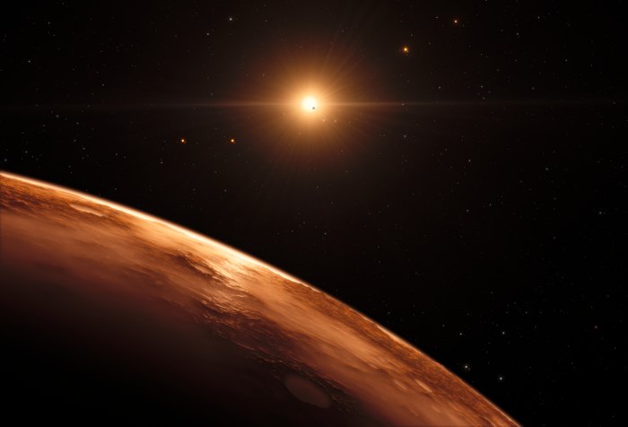Impressão artística da vista de um planeta distante no sistema planetário TRAPPIST-1