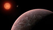 Představa pohledu na chladného trpaslíka TRAPPIST-1 z oběžné dráhy kolem jedné z jeho planet